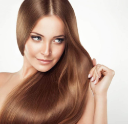 Female showing her hair after getting hair treatment