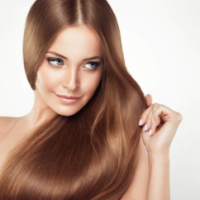 Female showing her hair after getting hair treatment